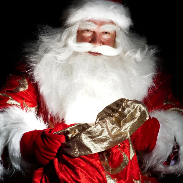 Noel Baba Noel odası oturma ve torbanın arıyorum — Stok fotoğraf