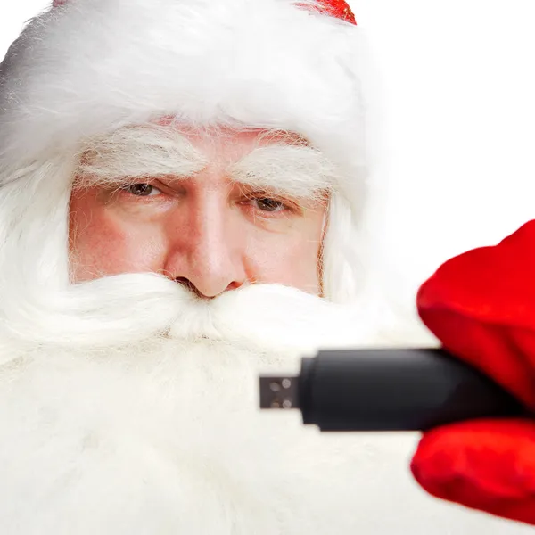 Traditional Santa Claus holding 3g usb modem in his arm on foreg — Stock Photo, Image