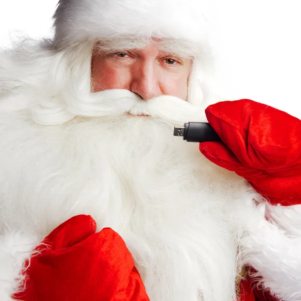 Traditional Santa Claus holding 3g usb modem in his arm on foreg — Stock Photo, Image