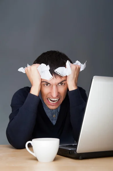 Closeup of a young angry business man having a stress. Headache. — Stock Photo, Image