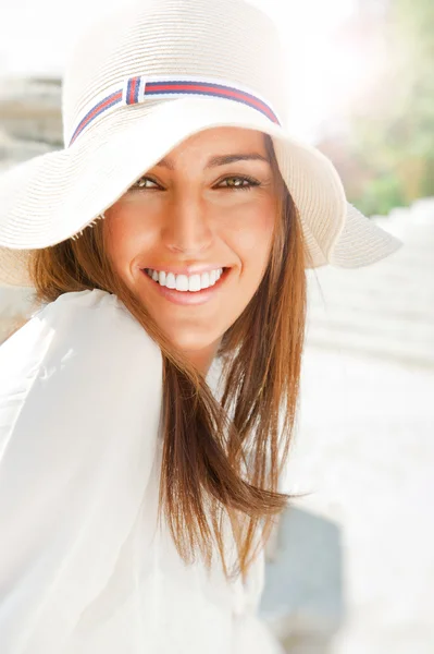 Portrait of pretty cheerful woman wearing white dress and straw — Stock Photo, Image