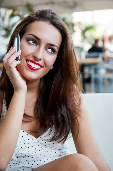 Closeup portrait of a pretty young female sitting at cafe in mor — Stock Photo, Image