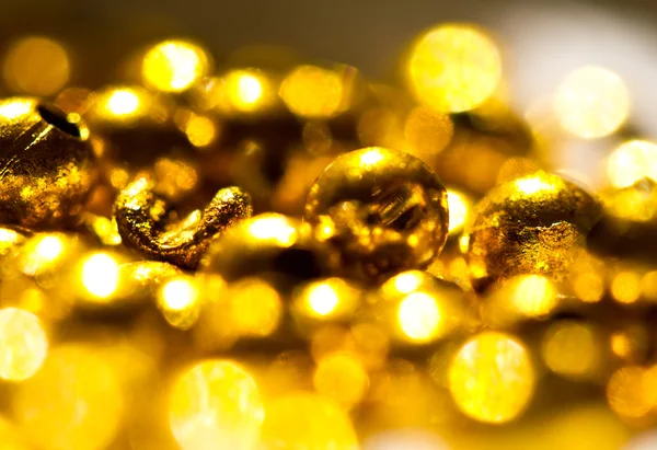 Zlaté korálky s otvorem — Stock fotografie