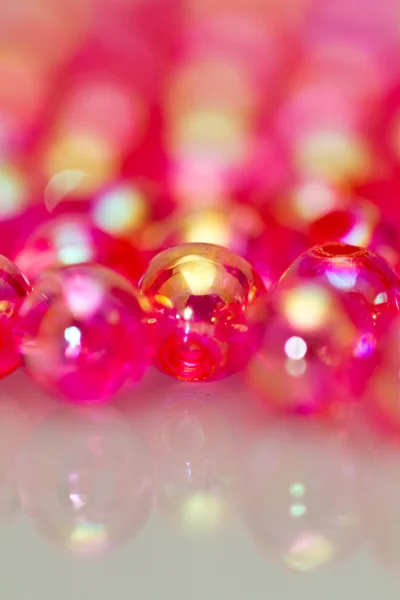 Red beads vertical background II — Stock Photo, Image