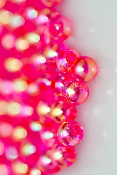 Perles rouges fond vertical V — Photo
