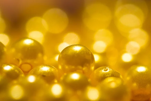 Gyllene gula pärlor bakgrund — Stockfoto
