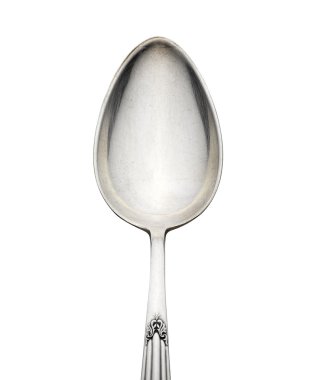 Old silver spoon with ornament isolated on white background clipart