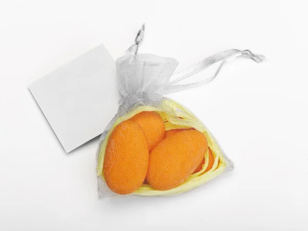 Dragee on a white background and a card for an inscription — Stock Photo, Image