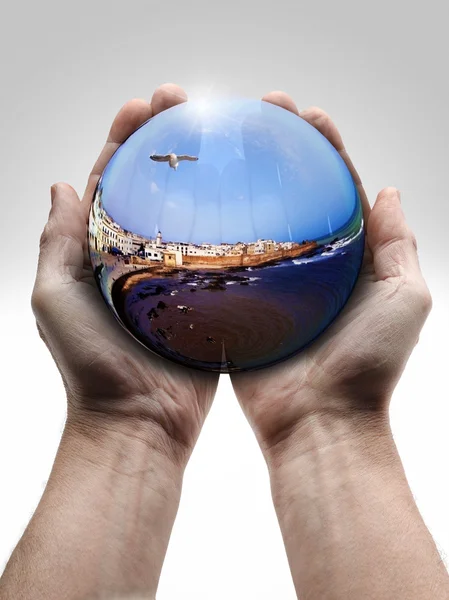 Male hand holding a crystal ball — Stock Photo, Image
