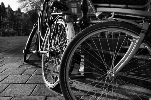 Stock image Holland, Amsterdam, bicycles parked by a bridge