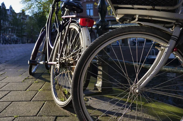 stock image Holland, Amsterdam, bicycles parked by a bridge