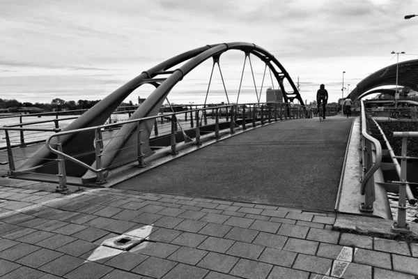 Holland, Amsterdam, bikers on a bridge — Stock Photo, Image