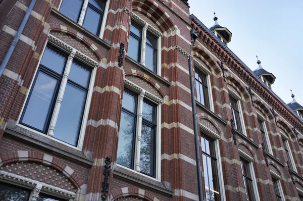 stock image Holland, Amsterdam, the facade of old private stone houses