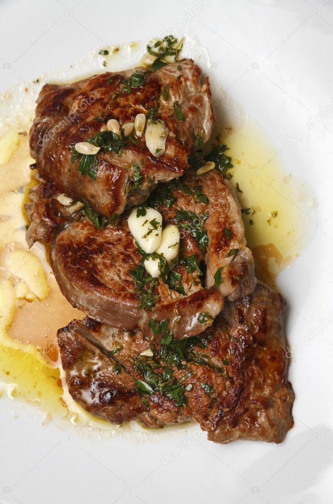 Grilled tenderloin steak served with a garlic