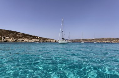 Malta Island, sailing boats in Comino's Blue Lagoon clipart