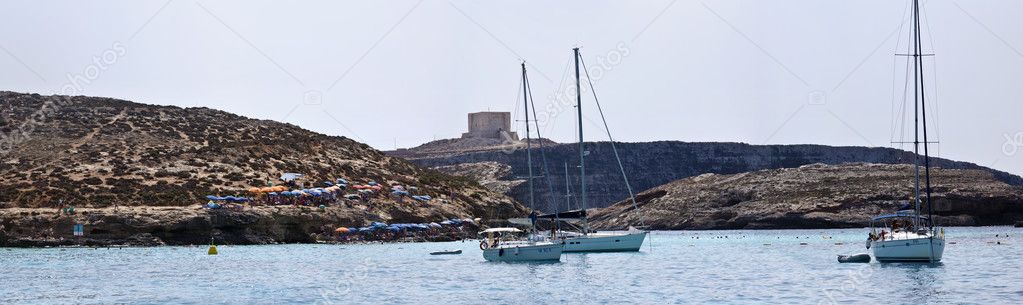 Malta Island, old Saracin tower and sailing boats