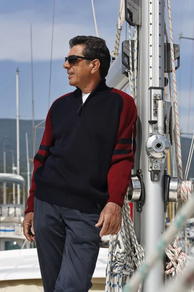 Italy, Tuscany, middle aged man on a sailing boat Stock Picture