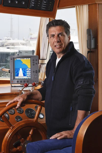 Italy, Tuscany, Viareggio port, mature sailor in his wooden boat — Stock Photo, Image