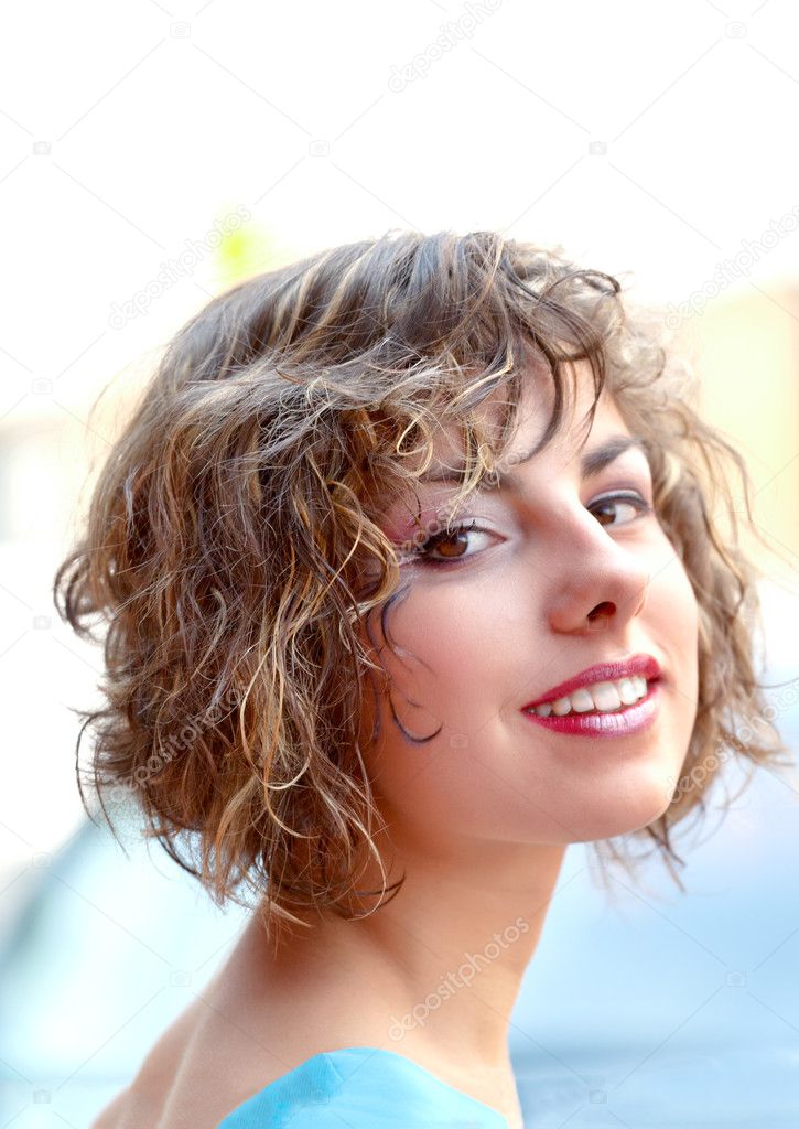 Portrait of a beautiful young woman outdoors