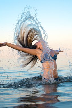 Blonde woman on water bckground clipart