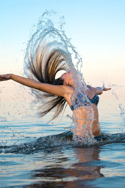 stock image Blonde woman on water bckground