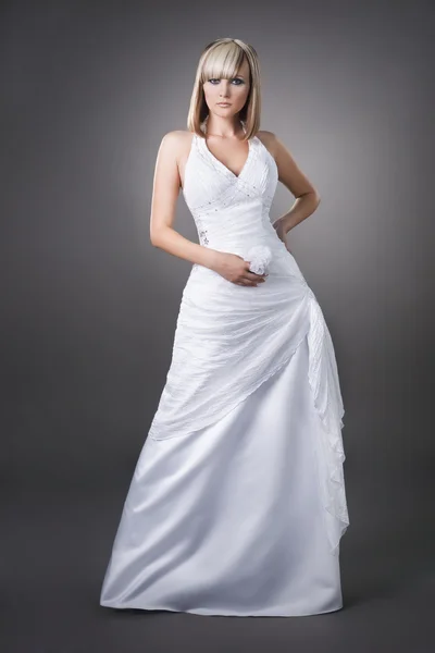 Confident blond bride wearing wedding dress studio shoot — Stock Photo, Image