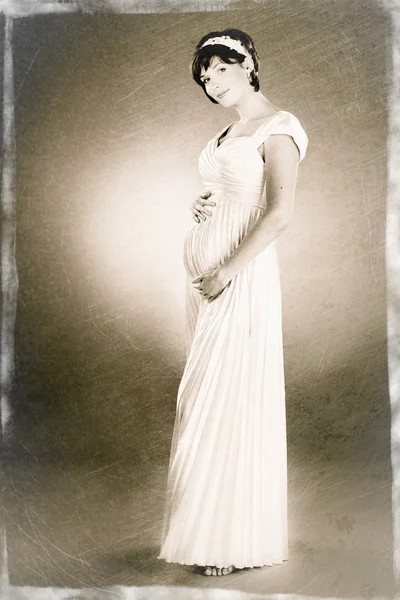 Sepia photo of beautiful young pregnant woman — Stock Photo, Image