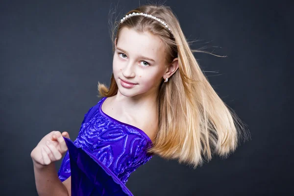 Portrait of teenager girl dancing on studio black background — Stock Photo, Image