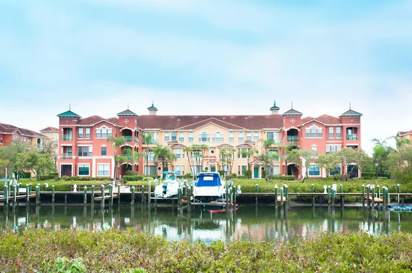 stock image Luxury waterfront condo with yacht