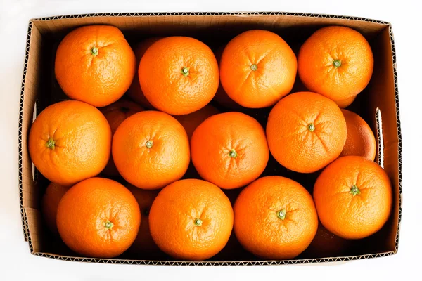 stock image Oranges in the box isolate on white background