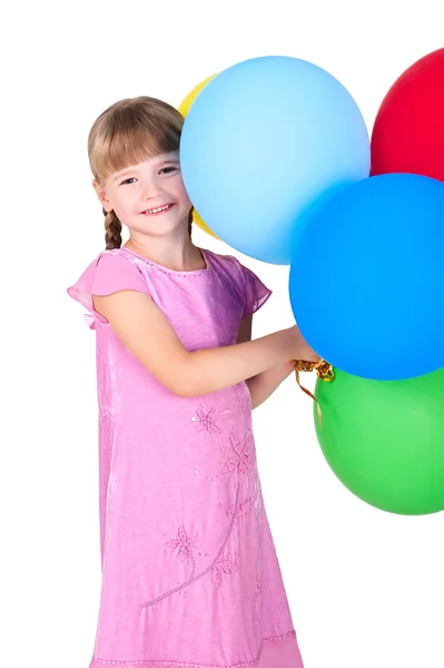 Gülümseyen kız beyaz zemin üzerine izole balonlar şube holding — Stok fotoğraf