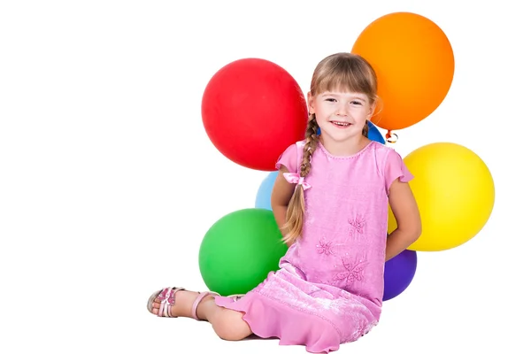 Skrattande liten flicka håller ballonger gäng isolerade på vit bakgrund — Stockfoto