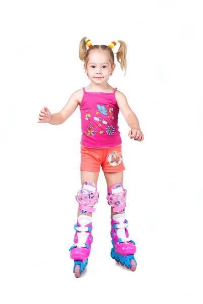 Cute roller skating little girl isolated on white background — Stock Photo, Image