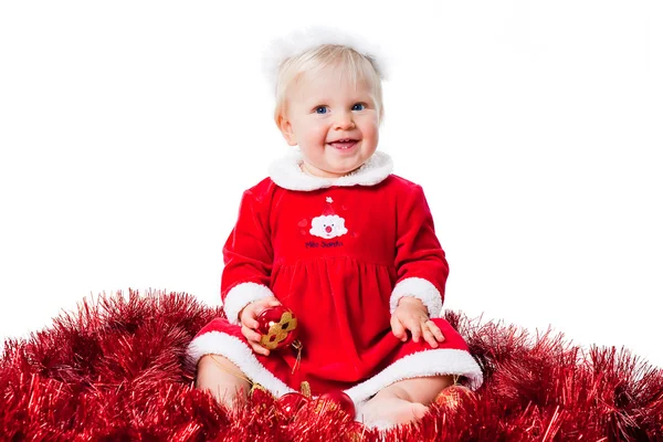 Feliz Natal menina infantil vestindo terno de Papai Noel sentado no chão — Fotografia de Stock