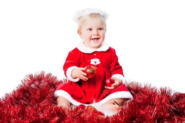 Szczęśliwego nowego roku dla niemowląt dziewczyna nosi garnitur santa siedzi na podłodze — Zdjęcie stockowe