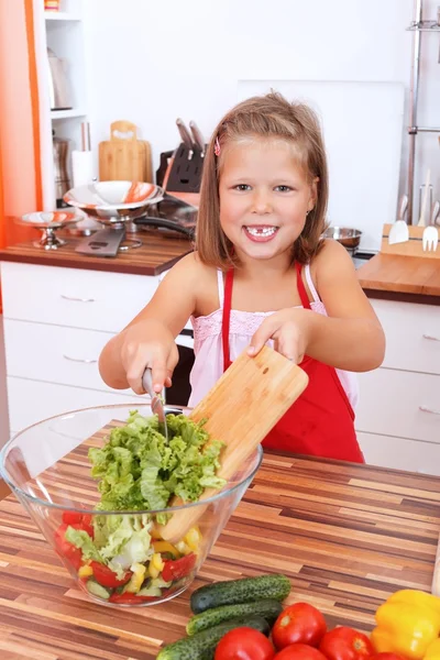 Girl making salad — Stock Photo, Image