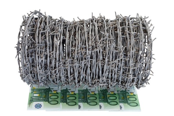 Money and barbed wire