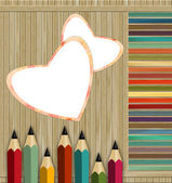 barevné tužky na dřevěném pozadí