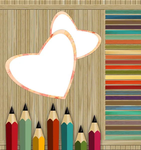Кольорові олівці на дерев'яному фоні — стокове фото