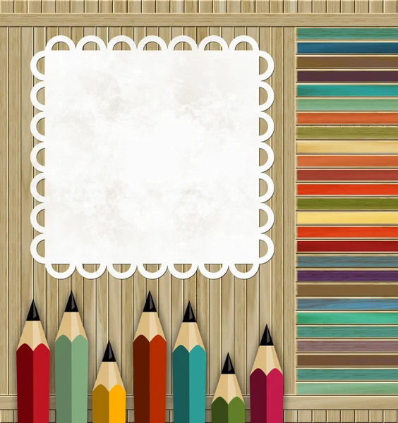 Lápis coloridos em um fundo de madeira — Fotografia de Stock