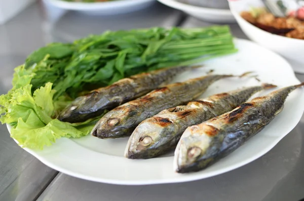 Fried sardine on plate in Asian restaurant — Stock Photo, Image