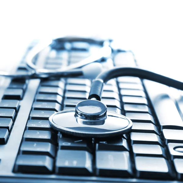 stock image Stethoscope on keyboard