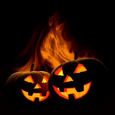 Scary Halloween pumpkins in fire clipart