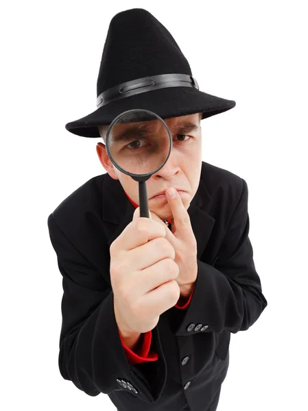 Sceptisch detective op zoek via Vergrootglas — Stockfoto