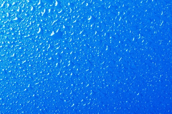 Синя текстура тла покрита краплями води — стокове фото