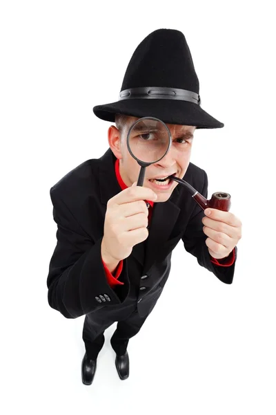 stock image Curious detective looking through magnifier