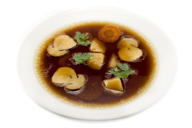 Plate of mushroom soup on white background clipart