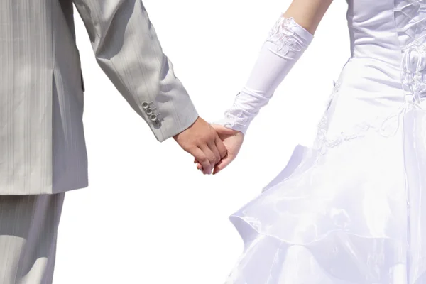 Bride and groom walking together holding their hands — Stock Photo, Image