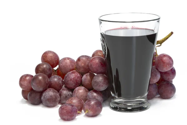 Een glas druivensap en tros druiven. Rechtenvrije Stockfoto's