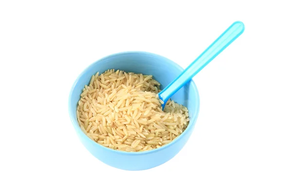 Hnědá rýže v blue bowl. — Stock fotografie
